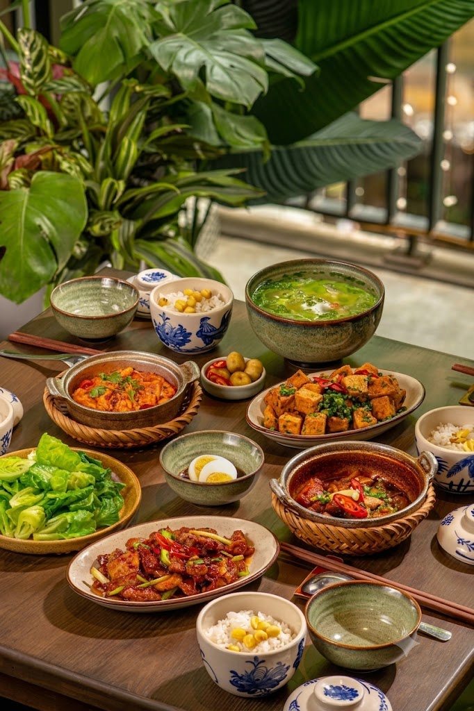 A shared Vietnamese-style family table of dishes at Palm Garden Resort